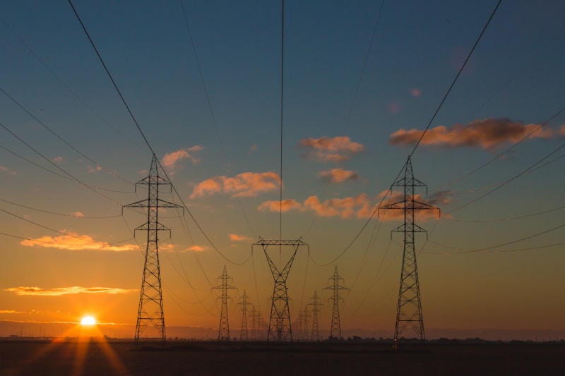 Electricity transmission pylons at sunset